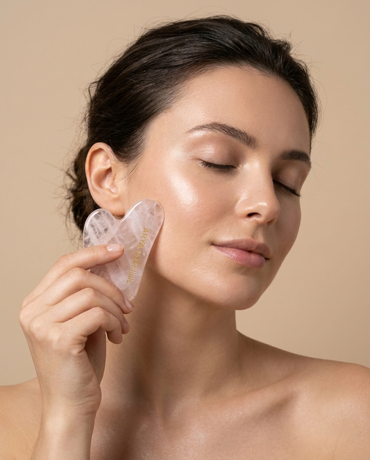 Model using rose quartz gua sha